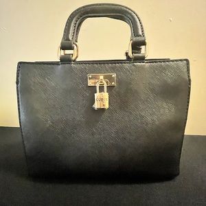 GUESS Mini Top Handle Bag.  Two open pockets and one zippered inside.